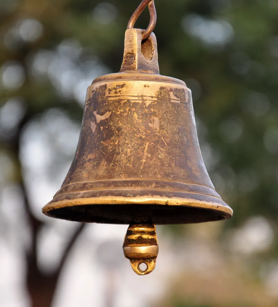 A brass bell hanging at the Thousand Pillar Temple